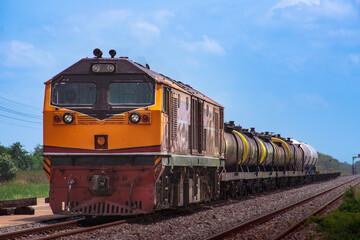 Fototapeta premium Tanker-freight train by diesel locomotive on the railway.