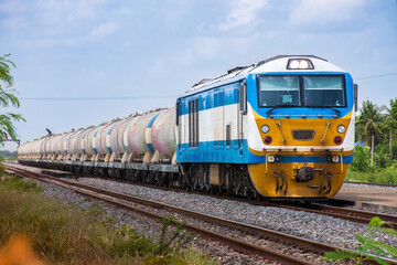 Fototapeta na wymiar Tanker-freight train by diesel locomotive on the railway.