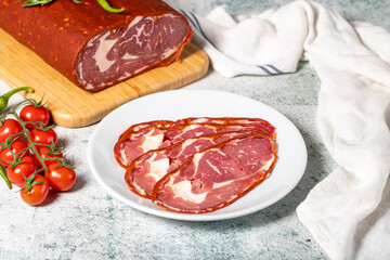 Beef ribeye bacon. Dried Turkish pastrami slices in plate. Traditional Turkish delicacies