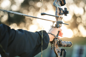 Hands, bow and arrow with aim for target, training and exercise for goal, mission and learning for...