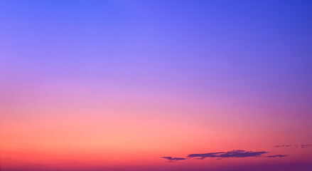 Colorful Dusk Sky in the Evening with beautiful romantic orange and yellow sunlight on dark blue Twilight sky background