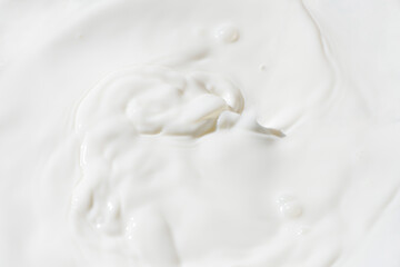 Fototapeta na wymiar splashing milk ,flowing wave milk texture background.