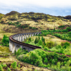 Glenfinnan Viaduct, Scotland. Travel tourist destination in Europe. Old historical steam train...