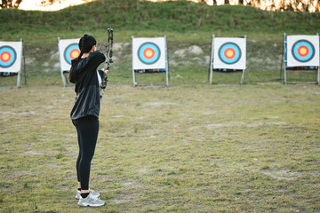 Sports, archery target and bow and arrow training for archer competition, athlete challenge or girl...