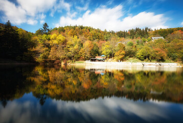 Fototapeta na wymiar Lake with autumn forest reflection in water, Slovakia - Tajch Klinger