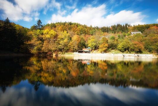 Lake with autumn forest reflection in water, Slovakia - Tajch Klinger