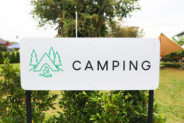 Fototapeta premium Camping sign with tent in camp.
