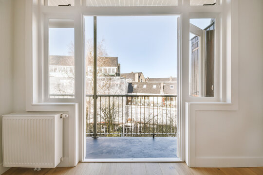 Interior of room with opened door leading to balcony
