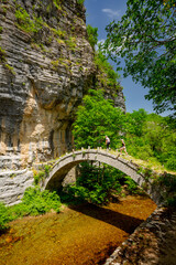 Fototapeta na wymiar Zagorohoria stone bridge, Greece. Lazaridi arch bridge