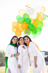 Young happy indian women wearing white dress celebrating independence day or republic day while...