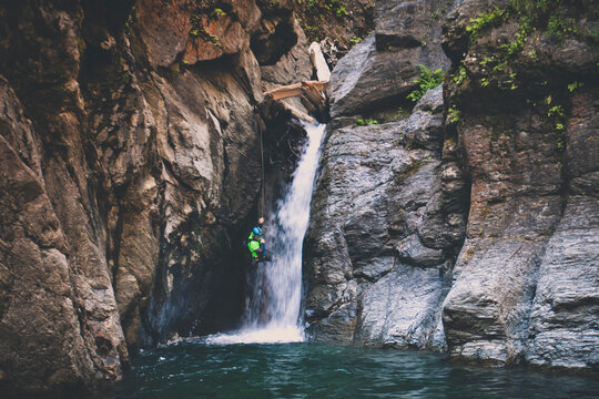 Man canyoneering in Deneau Creek, Hope, British Columbia, Canada