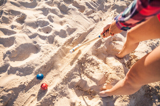 Woman playing croquet on beach,&Acirc;&nbsp;Rottnest&Acirc;&nbsp;Island, Perth, Western Australia, Australia