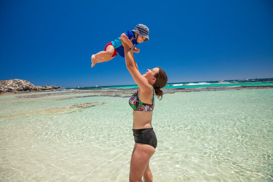 Mother and baby son enjoying coastal beach, Yallingup, Western Australia, Australia