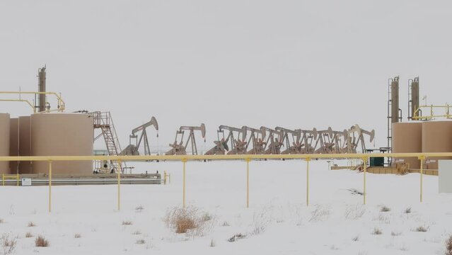 Pump Jacks in winter on the colorado plains.
