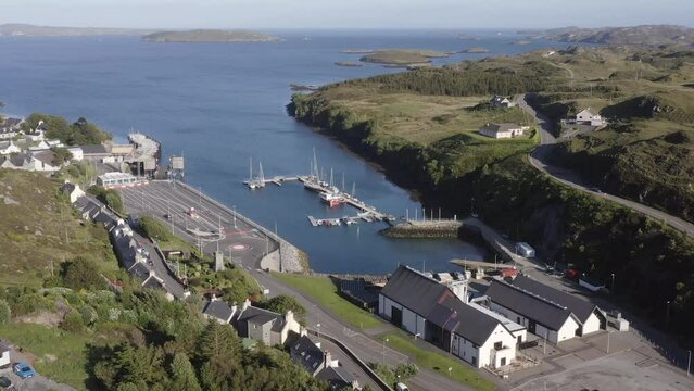 Drone shot of the village of Tarbert, featuring the Isle of Harris Distillery. Filmed on the Isle of Harris, part of the Outer Hebrides of Scotland.