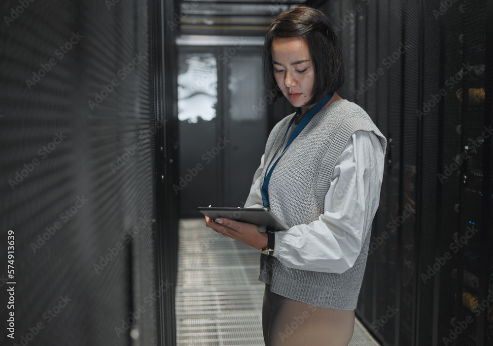 Aufkleber Tablet, server room and dashboard with a programmer asian woman at work on a computer mainframe. Software, database and information technology with a female coder working alone on a cyber network