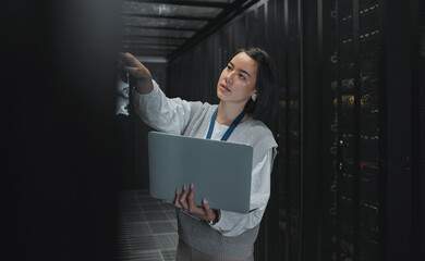 Laptop, maintenance or IT woman in server room for research, engineer working in data center....