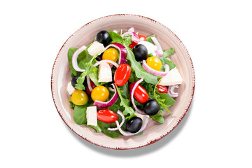Isolated Greek salad closeup. Top view of vegetable salad with feta cheese, arugula, cherry...
