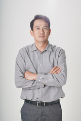 Asian man gray shirt confident gesture cross arm white background