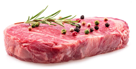 Ribeye steak with peppercorn and rosemary isolated on white background. Closeup.