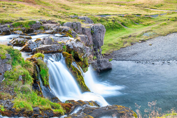 Kirkjufellfoss waterfalls at summer sunset, Iceland
