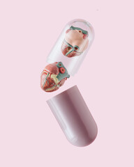 Human hearts falling out of maroon-transparent pill on isolated pastel pink background. Minimal scientific or medical concept. The idea of empathy, compassion, medicine, healing, health or healthcare.