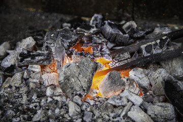 Burning coal in a forge