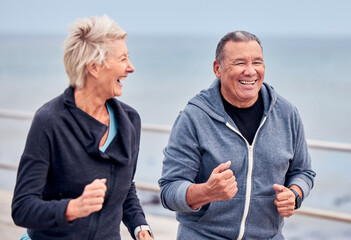 Running, fitness and senior couple smile by ocean for exercise, healthy body and wellness in...