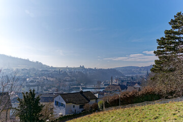 Naklejka premium Aerial view over City of Schaffhausen on a sunny winter day with local mountain Cholfirst in the background. Photo taken February 16th, 2023, Schaffhausen, Switzerland.