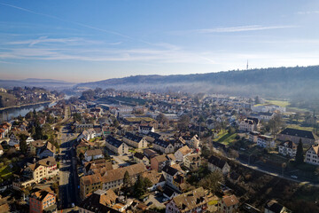 Obraz premium Scenic view of village of Feuerthalen with Cholfirst communications tower in the background on a sunny winter day. Photo taken February 16th, 2023, Schaffhausen, Switzerland.