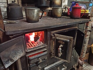 wood burning stove with teapots heating up