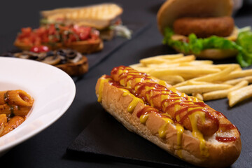 Hotdog with ketchup and fries