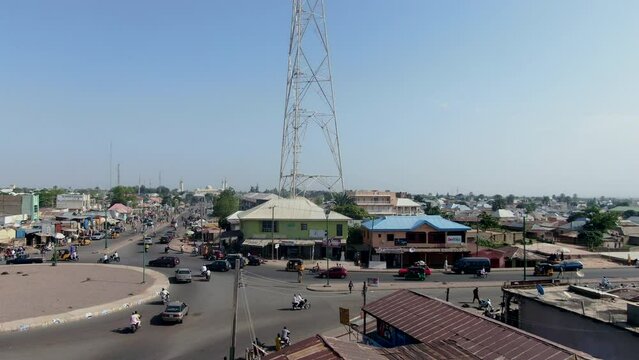 Busy roundabout in Gombe, Nigeria - pull back aerial reveal