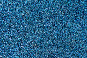 Close up of blue rubber floor background. rubber flooring for sports and playgrounds.