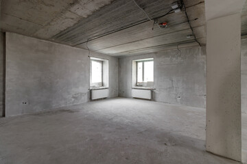 Spacious empty rooms floor after filling out the work on the wall and ceiling