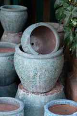 Stacks of various terracotta pots for plants for sale at a garden center store