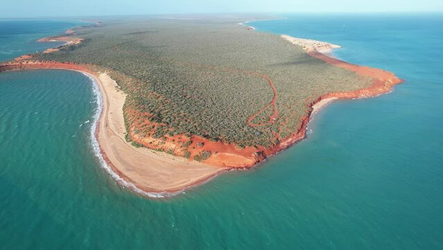 Aerial video of Cape Peron in Francois Peron national park. View from the sky with drone. Aerial footage of orange land, beach and forest in Shark Bay, Western Australia.	