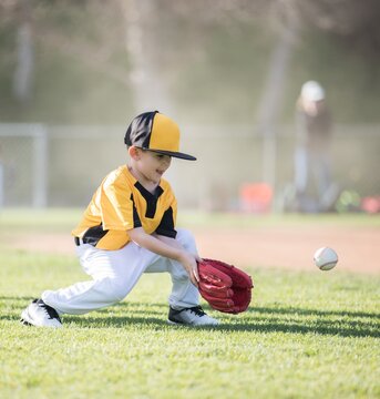 Boy playing baseball, California, USA