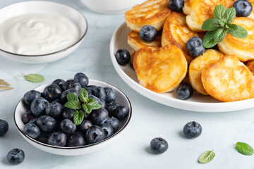Homemade mini pancakes with blueberries