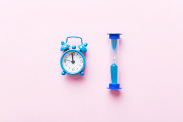 hourglass and clock as time passing concept for business deadline, urgency and running out of time