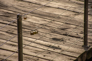 Group of padlocks on a bridge representing the love between two people and Valentine's Day.