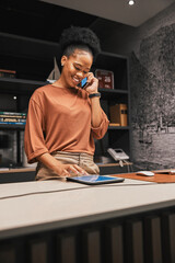 Black woman, phone call and tablet with small business and entrepreneur in office or store,...