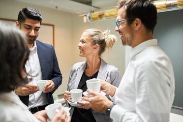 Relaxed small talk over a cup of coffee during a break