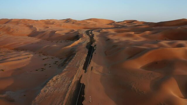 Asphalt road in sand dunes of Liwa desert, Abu-Dhabi, UAE