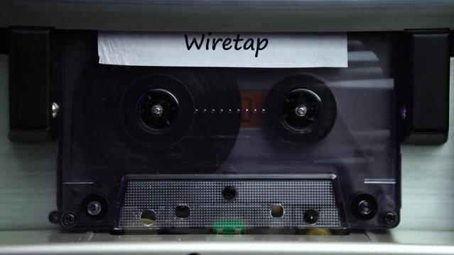 Inserting Wiretap Audio Recording on Cassette Tape in Player and Start Playing, Close Up