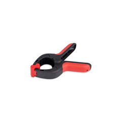 Obraz premium Plastic black and red spring clamp isolated over white background