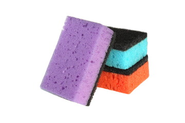 Bright multi-colored sponges in a stack lie on a white background.
