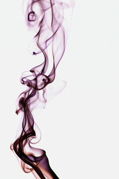 Abstract backdrop with stains of colorful incense smoke