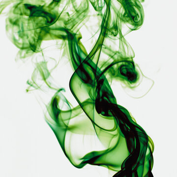 Abstract backdrop with stains of green incense smoke