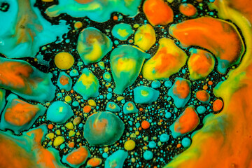 Vibrant multicolored drops of inks in oil